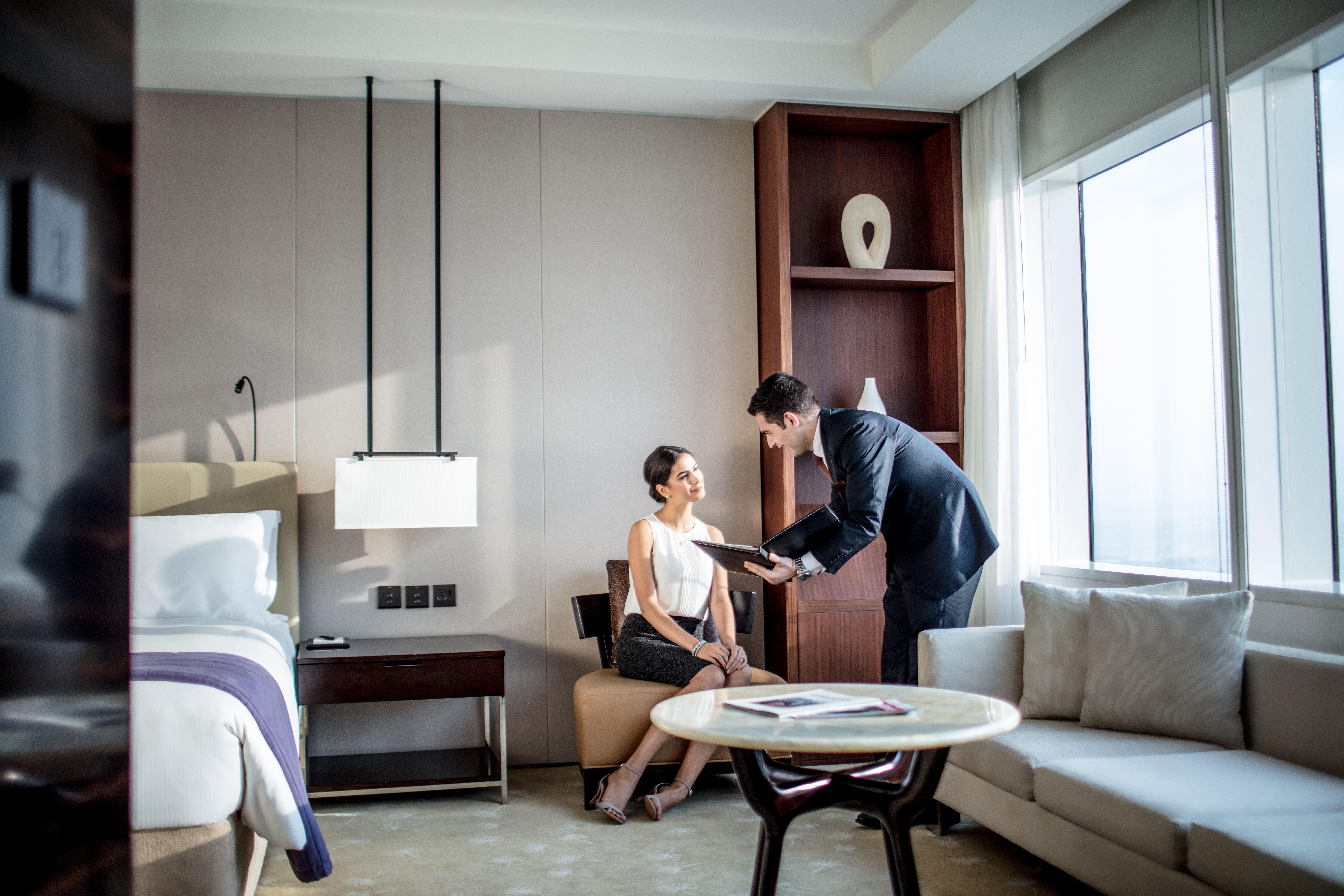 Intercontinental Dubai Festival City By Ihg Exteriör bild A guest being served by a butler at the Park Hyatt Hyderabad